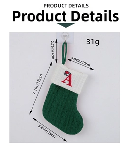 Detailed view of green knitted Christmas stocking with red letter A and size measurements