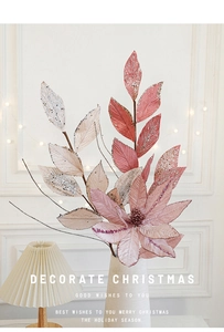 Detail of pink and champagne gold glitter poinsettia artificial flower in a white vase