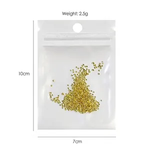 Mini gold metal rivet beads for nail art DIY in a clear bag, weight 2.5g and size 10x7cm