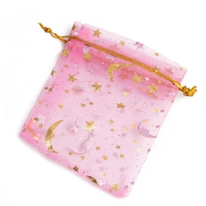 Pink organza gift bag featuring gold star and moon patterns with a drawstring closure