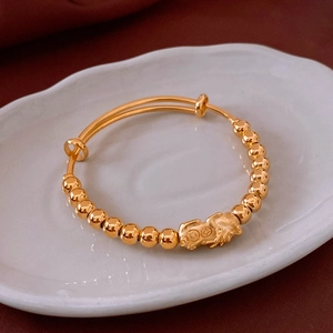 Detailed view of 18k gold plated Pixiu bracelet with adjustable beads and luxury finish