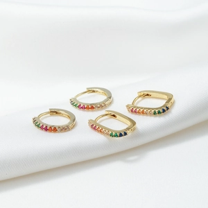 Fashionable golden hoop earrings set with colorful cubic zirconia and geometric design