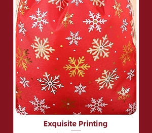 Detail of red Christmas drawstring pouch with gold and white snowflake foil printing
