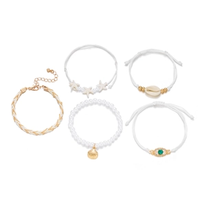 Five-piece gold pearl bracelet set with starfish and shell charms in beach style