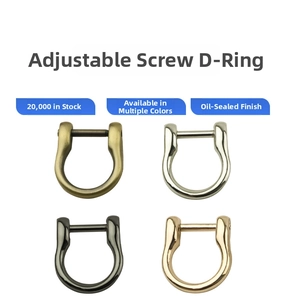 Detail view of four-color zinc alloy D-ring buckles with removable screw bars for bag straps