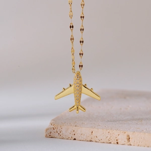 Elegant gold airplane pendant necklace with micro-pave diamonds on titanium steel chain