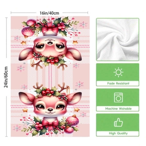 Pink Christmas dish towel with reindeer patterns and detailed absorbent fabric texture