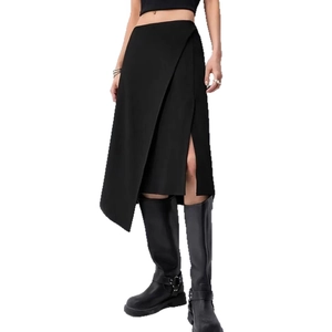 Detail view of the asymmetrical side slit and wrap design on a black high-waist midi skirt