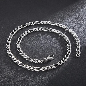 Detailed close-up of polished titanium steel NK chain with a minimalist coiled design