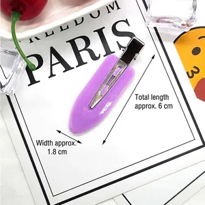 Detail view of a 6cm purple seamless hair clip showing acrylic finish and metal duckbill