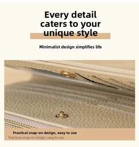 Detail of lychee pattern leather wallet showing interior card slots and metal snap button
