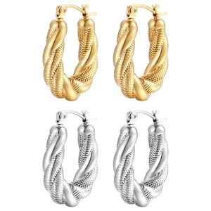 Detailed view of twisted rope texture hoop earrings in 18K gold and silver finishes