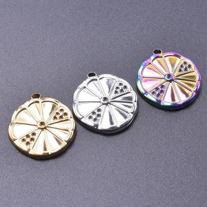Macro detail of round fruit-slice lemon pendants in gold, silver, and rainbow finishes