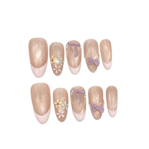 Handmade long almond press-on nails with purple 3D bows, pearls and flower charms