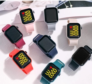 Flat lay of diverse silicone LED watches in multiple macaron colors with square cases