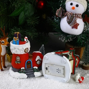 Lighted musical Christmas boot house resin ornament with glowing festive LED scene