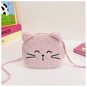 Detail of pink plush cat crossbody bag with soft faux fur texture and gold zipper closure