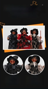Detailed view of three Halloween witch figurines with pointed hats and rustic broomsticks
