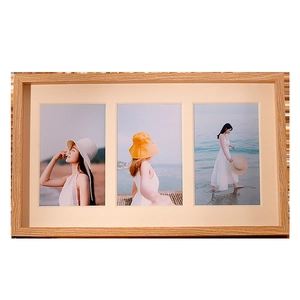 Modern light wood triple photo frame with natural grain and three vertical photo slots