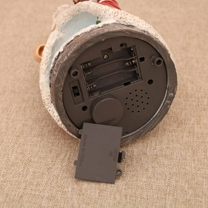 Detail view of the Christmas music box base with battery compartment and power switch