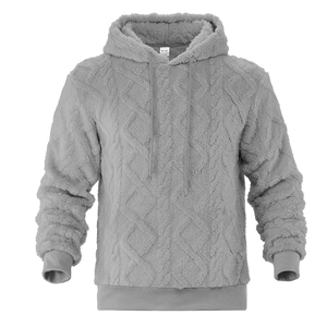 Detail view of heavy grey hoodie featuring textured diamond fleece fabric and drawstring hood