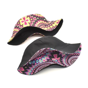 Double-sided bucket hat featuring vibrant geometric psychedelic prints and a solid black side