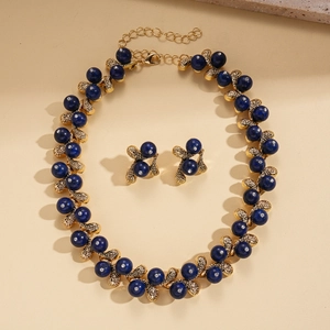 Vintage jewelry set with blue acrylic beads, floral leaf pendants and crystal studs