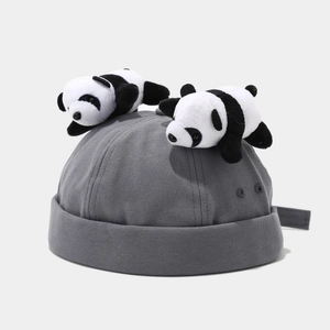 Grey brimless Docker hat featuring two cute plush panda decorations on the top