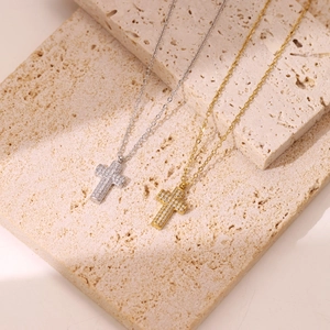 Minimalist micro-paved cross pendant necklaces in gold and silver finish for women