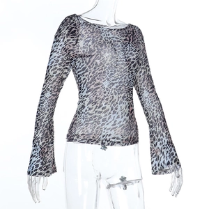 Detail of sheer leopard print mesh top showing translucent fabric and flared cuffs