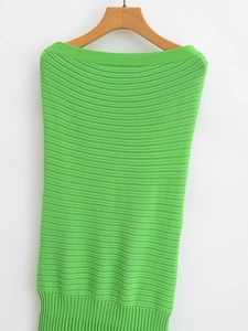 Close-up of green knitted off-shoulder bodycon dress with textured horizontal stripes