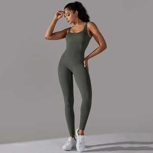 Detailed close-up of dark olive green seamless ribbed fabric on a one-piece yoga jumpsuit