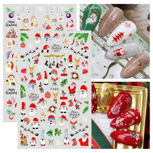 Christmas nail art stickers featuring Santa, reindeer and festive patterns with application