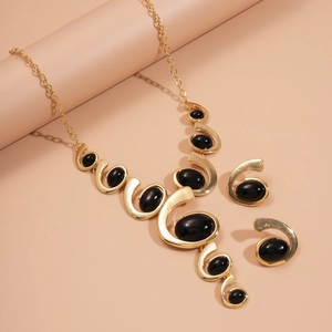 Parure rétro collier et boucles d'oreilles spirales dorées avec pendentifs ovales noirs