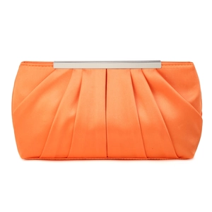 Detail of orange pleated satin clutch bag with glossy texture and silver metal clasp