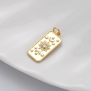 Macro view of golden celestial pendant with moon and sun relief patterns