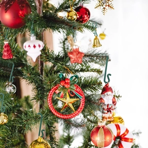 Green S-shaped Christmas tree hooks for hanging ornaments and holiday decorations