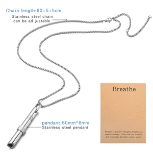 Detail showing 528Hz breathing whistle pendant with chain length and size card