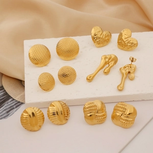 Irregular minimalist gold earrings collection including heart and geometric patterns