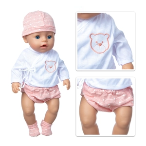Detailed view of 18-inch doll outfit with pink bear embroidery and polka dot patterns