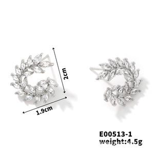 Detail view of silver wheat leaf earrings with marquise-cut zircon and size measurements