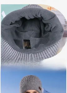 Detail of gray winter beanie showing thick fleece lining and soft knitted texture for warmth