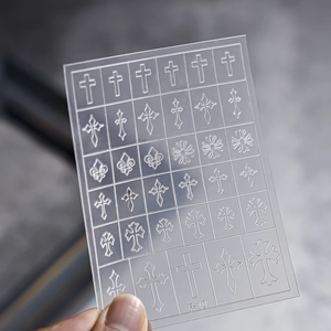 Detail shot of F-10 nail art template featuring hollow cross and lily floral patterns