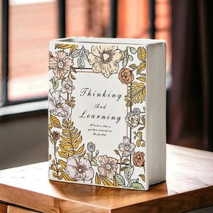 Creative book shaped ceramic vase with floral prints and thinking and learning text detail