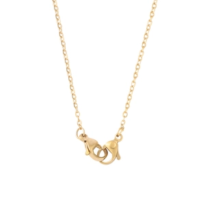 Detailed close-up of double lobster clasps on a polished gold stainless steel chain