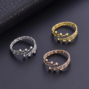 Three-layer stainless steel beaded rings in silver, gold, and rose gold finishes