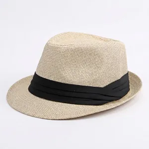 Classic beige straw Panama hat with black ribbon, sun protection for beach and travel