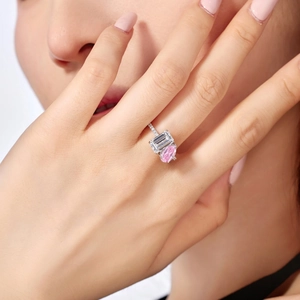 Elegant S925 silver ring featuring emerald-cut clear and pear-shaped pink cubic zirconia