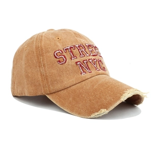 Detailed close-up of distressed brim with 3D embroidery on vintage NYC cotton baseball cap