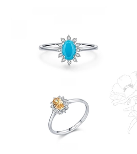 Macro detail of S925 silver sunflower rings with oval turquoise and champagne stones